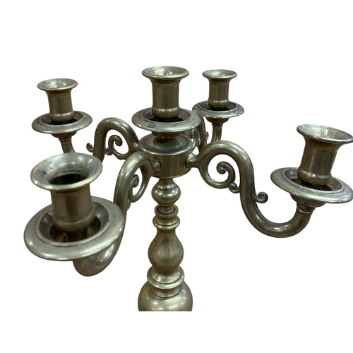 1076 - Pair of antique brass five sconce table candelabra, each having a stepped circular base with a beehi... 