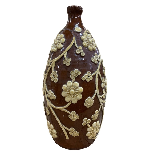 418 - Interesting brown glazed pottery cider flagon, having applied floral and trail clay relief, H 38cm