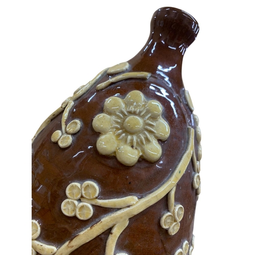 418 - Interesting brown glazed pottery cider flagon, having applied floral and trail clay relief, H 38cm