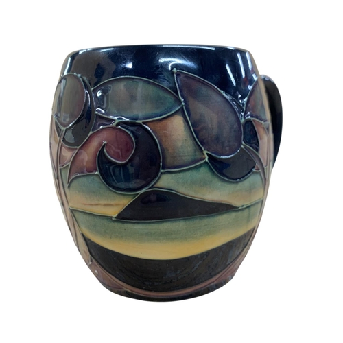 433 - Moorcroft Pottery mug in the Western Isles pattern, stamped to base with Sian Leeper artist monogram... 