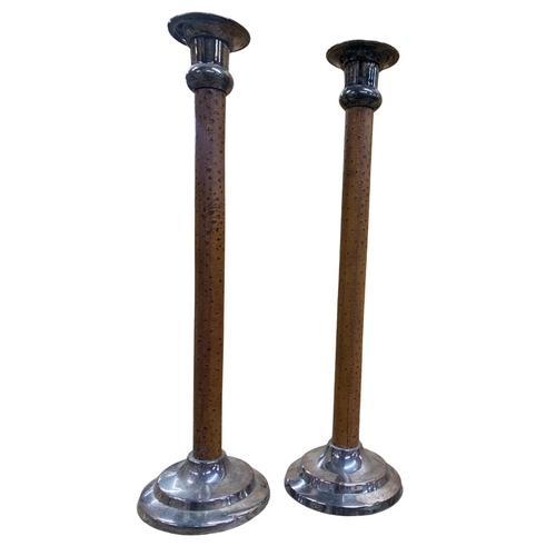 1094 - Kenneth Turner of London - A pair of leather and silver plated candlesticks, together with a larger ... 