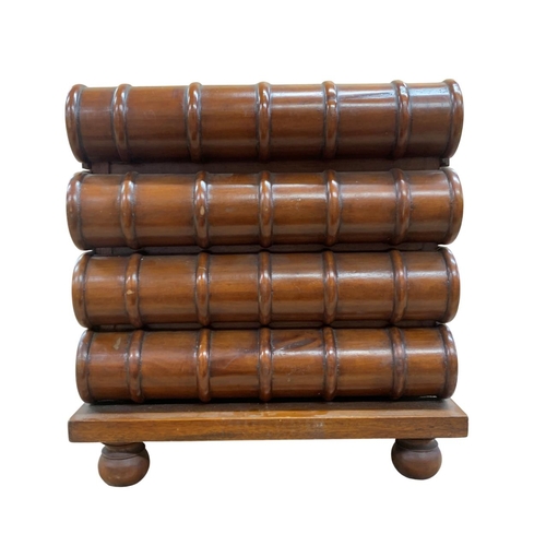 498 - Table top novelty mahogany set of four drawers modelled as a stack of books, H 36cm x W 33cm