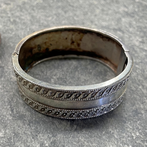 31 - Good quality silver hinged bangle by Robert James Dick, another by Frank William Cole and a third by... 