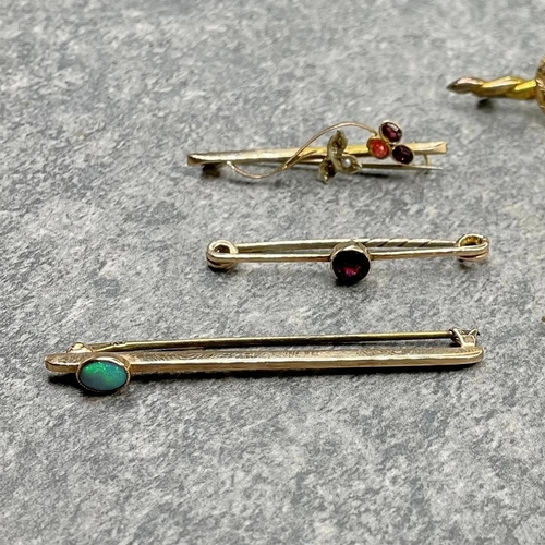 28 - Six 9ct bar brooches, three with garnets, a good opal example and two others, 10.6g gross