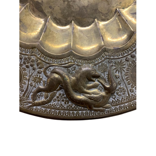 335 - Antique Eastern brass brazier or charger, embossed with beasts and hunting scenes, 71cm diameter
