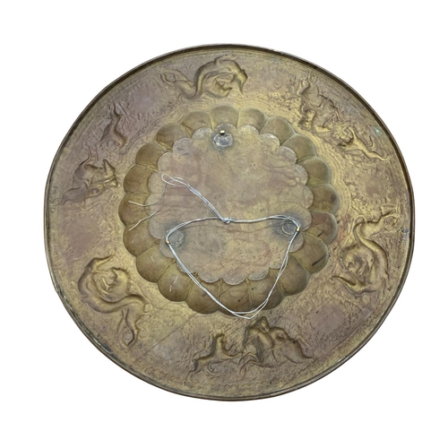 335 - Antique Eastern brass brazier or charger, embossed with beasts and hunting scenes, 71cm diameter