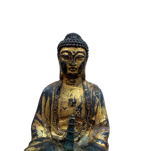 341 - 19th century Chinese gilt metal statue in the form of a seated Buddha holding a pagoda, H 19cm