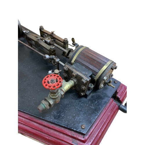 614 - Single cylinder horizontal stationery steam engine with 8 inch fly wheel, together with a vertical b... 