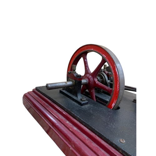 614 - Single cylinder horizontal stationery steam engine with 8 inch fly wheel, together with a vertical b... 