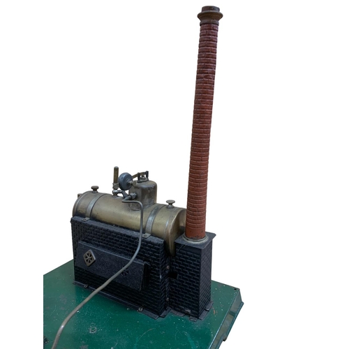 615 - Single cylinder horizontal stationery steam engine with 5 inch fly wheel, brass boiler and chimney, ... 