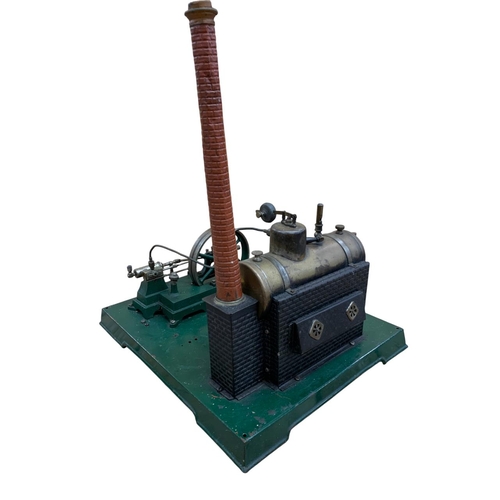 615 - Single cylinder horizontal stationery steam engine with 5 inch fly wheel, brass boiler and chimney, ... 