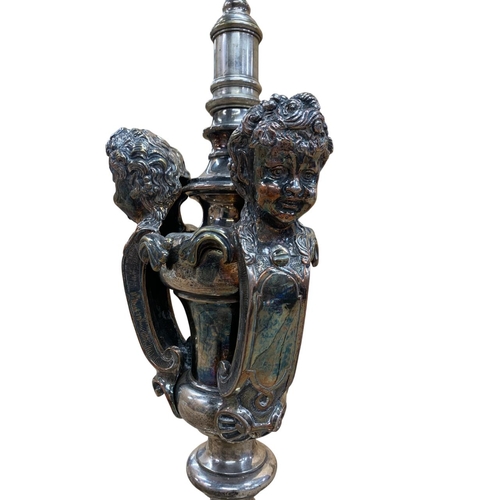 1080 - Impressive silver plated table lamp, having stepped circular base adorned with columns and a three p... 