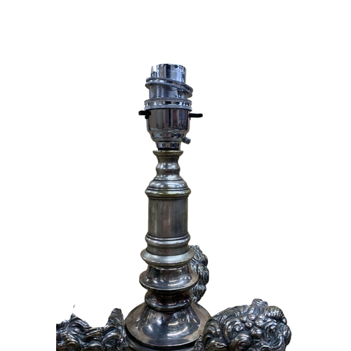 1080 - Impressive silver plated table lamp, having stepped circular base adorned with columns and a three p... 