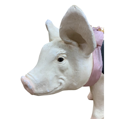 609 - Large plaster butchers shop display styled piggy bank in the form of a sitting pig with ribbon and s... 