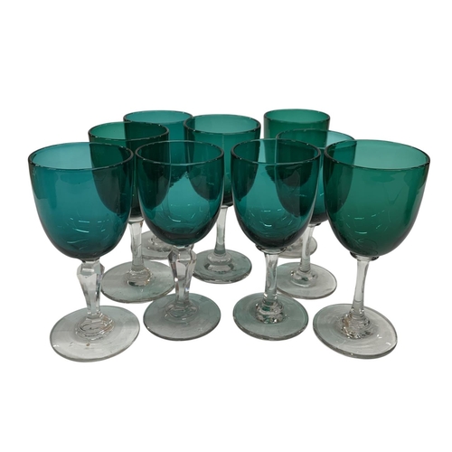 391 - Two emerald glass decanters to include mushroom stopper example with a further nine wine glasses (11... 