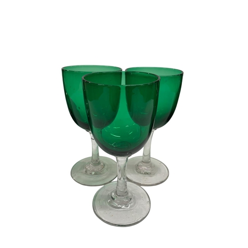 392 - Mixed quantity of green glass to include twisted handle decanter, ships flat bottom decanter with et... 