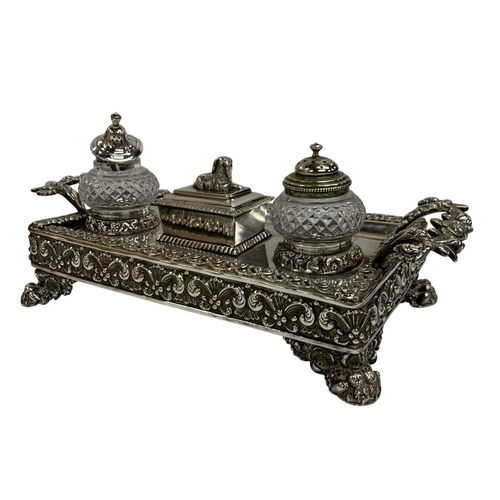 149 - Exceptional silver plated desk standish, having ornate floral twin handled form with lion paw feet a... 