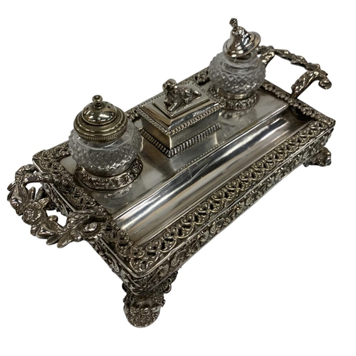 149 - Exceptional silver plated desk standish, having ornate floral twin handled form with lion paw feet a... 