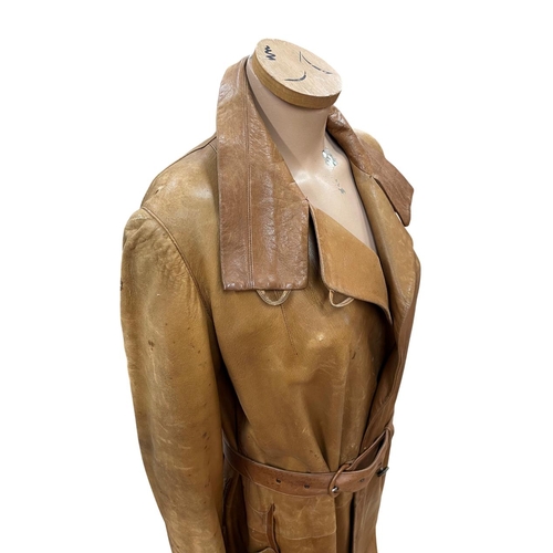 619 - Female mannequin atop wooden plinth base, holding vintage brown leather coat, H 125cm