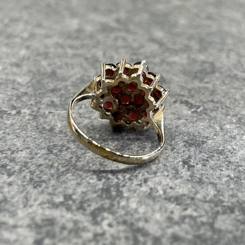 23 - Two 9ct garnet cluster rings, size M and K respectively, 5.7g