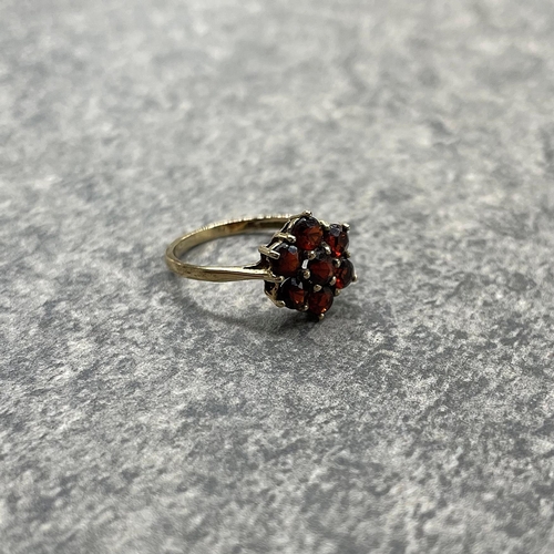 23 - Two 9ct garnet cluster rings, size M and K respectively, 5.7g