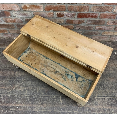 1183 - 19th Century rectangular pine dough bin, of casket form, with hinged lid, raised upon four turned fe... 