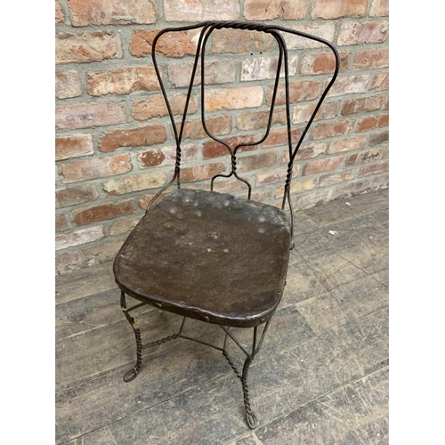 1188 - Antique French iron garden chair with twisted wirework frame, the seat with historic repair, H 89cm