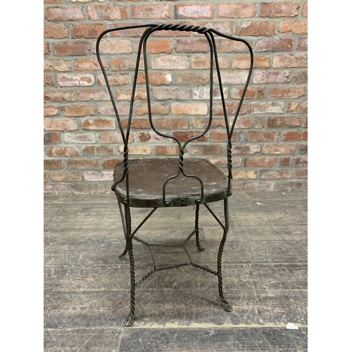 1188 - Antique French iron garden chair with twisted wirework frame, the seat with historic repair, H 89cm