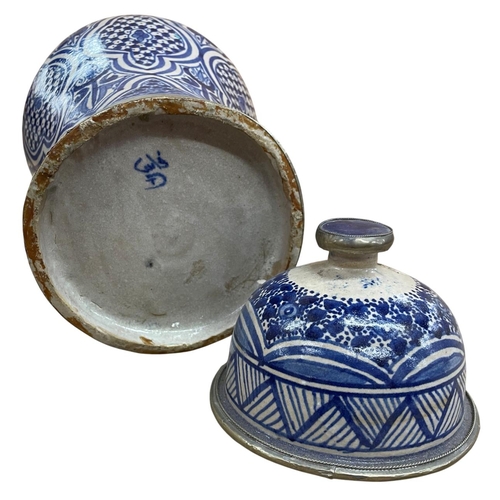 441 - Moroccan blue and white lidded urn vase with underglaze repeating cartouche decoration and geometric... 