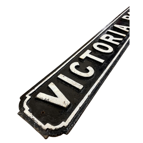 1016 - Victorian Road cast iron street sign, white lettering in relief on a black ground, H 17cm x W 124cm