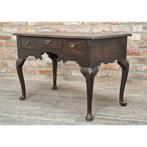 1223 - Georgian oak lowboy with three drawers raised on cabriole legs, H 69cm x W 104cm x D 55cm