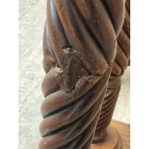 1236 - Three 19th century mahogany torcheres with barley twist columns and carved detail, largest H 135cm (... 