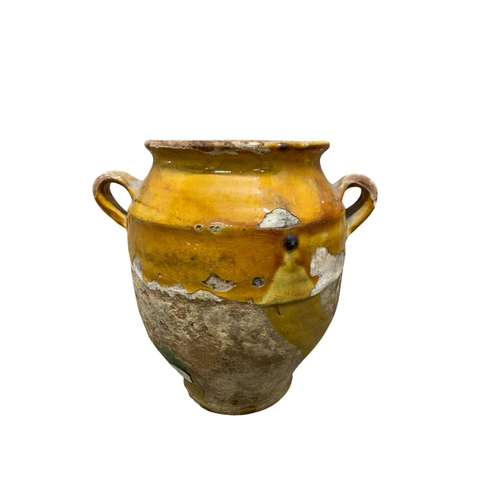 443 - Two antique French drip glazed terracotta pots and a further twin handled example, tallest 29cm. (3)