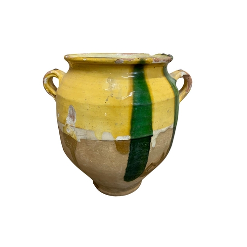 443 - Two antique French drip glazed terracotta pots and a further twin handled example, tallest 29cm. (3)