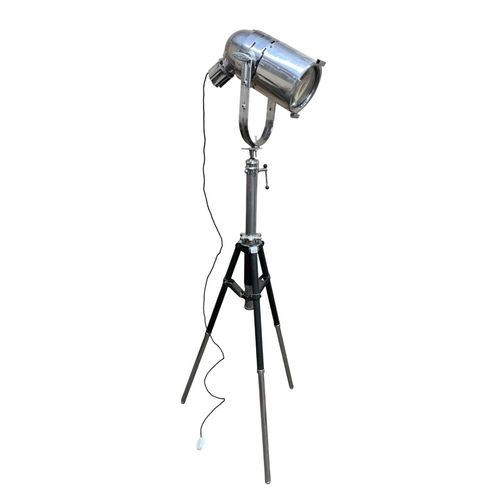 1070 - Large 'Century' chrome theatre spotlight held atop sturdy tripod base, H 180cm