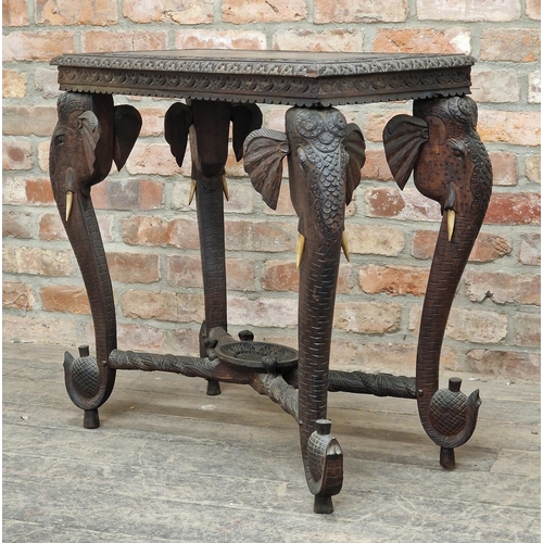 1305 - Anglo Indian carved hardwood side table with elephant supports, H 77cm x W 76cm x D 40cm