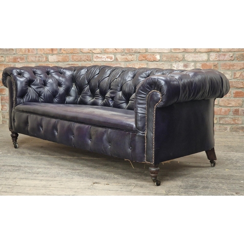 1318 - Victorian leather chesterfield sofa with studded edging raised on ceramic castors, H 72cm x W 200cm ... 