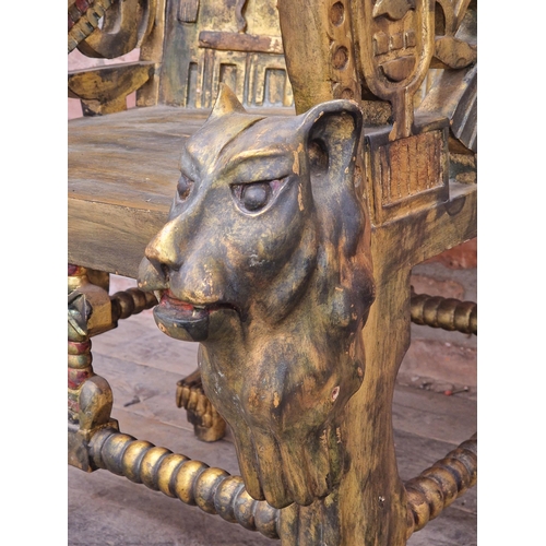 1199 - 20th century Egyptian style throne chair with carved detail raised on paw feet, H 102cm x W 65cm x D... 