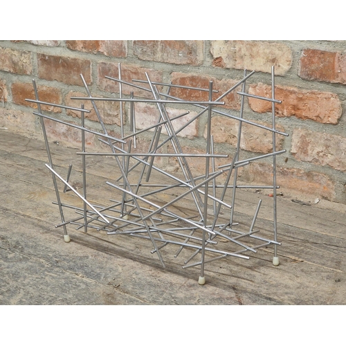 1202 - Alessi - Contemporary chrome 'blowup' magazine rack, H 36cm x W 46cm x D 25cm