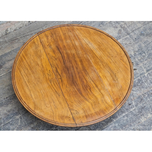 1205 - Victorian walnut lazy susan raised on a scrolled tripod base, H 21cm x diameter 69cm