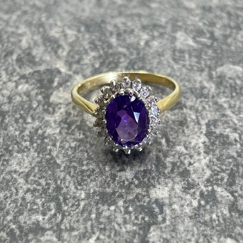 43 - 18ct amethyst and diamond cluster ring, central stone 1.5ct approx framed by eighteen diamonds, size... 