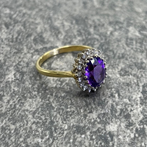 43 - 18ct amethyst and diamond cluster ring, central stone 1.5ct approx framed by eighteen diamonds, size... 