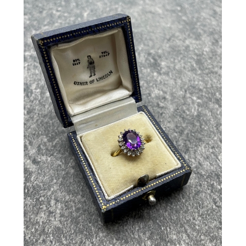 43 - 18ct amethyst and diamond cluster ring, central stone 1.5ct approx framed by eighteen diamonds, size... 