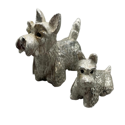 190 - Christofle of France - Two 'Lumiere D'argent' Scottish Terrier dogs, tallest 6cm. (2)