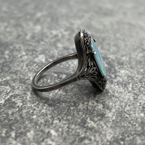 69 - Victorian black opal unmarked white metal ring, the opal set in a pierced mount, size N