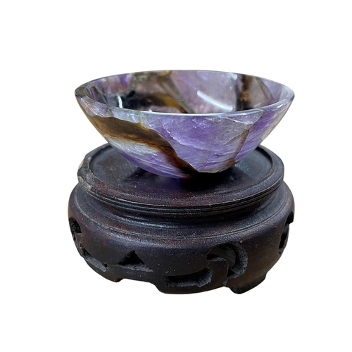 243 - Miniature amethyst bowl Grand Tour souvenir, atop later carved Chinese stand, bowl H 2cm X D 5.5cm