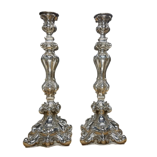 138 - Pair of silver plated Sabbath candlesticks, each being moulded in relief with scroll and foliate dec... 