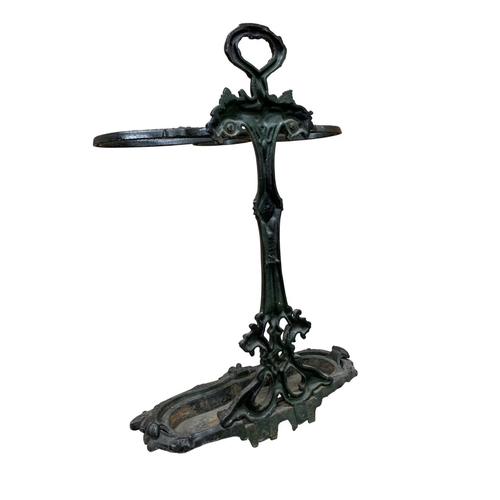 555 - Victorian coalbrookdale black painted cast iron stick stand with scrolling and leaf detail, complete... 