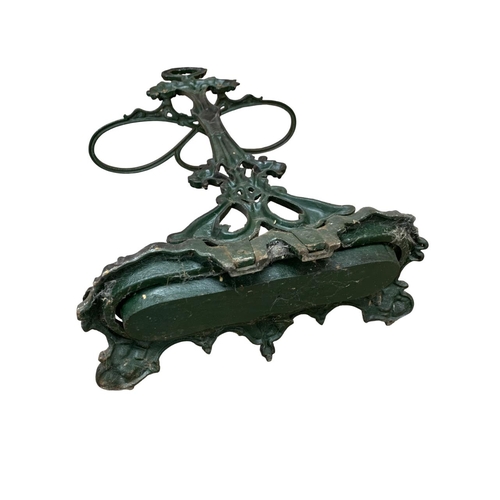 555 - Victorian coalbrookdale black painted cast iron stick stand with scrolling and leaf detail, complete... 