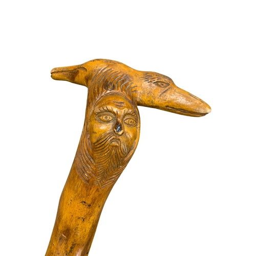 676 - Carved folk art walking stick, possibly Scandinavian, depicting a bearded man and twin duck heads, H... 